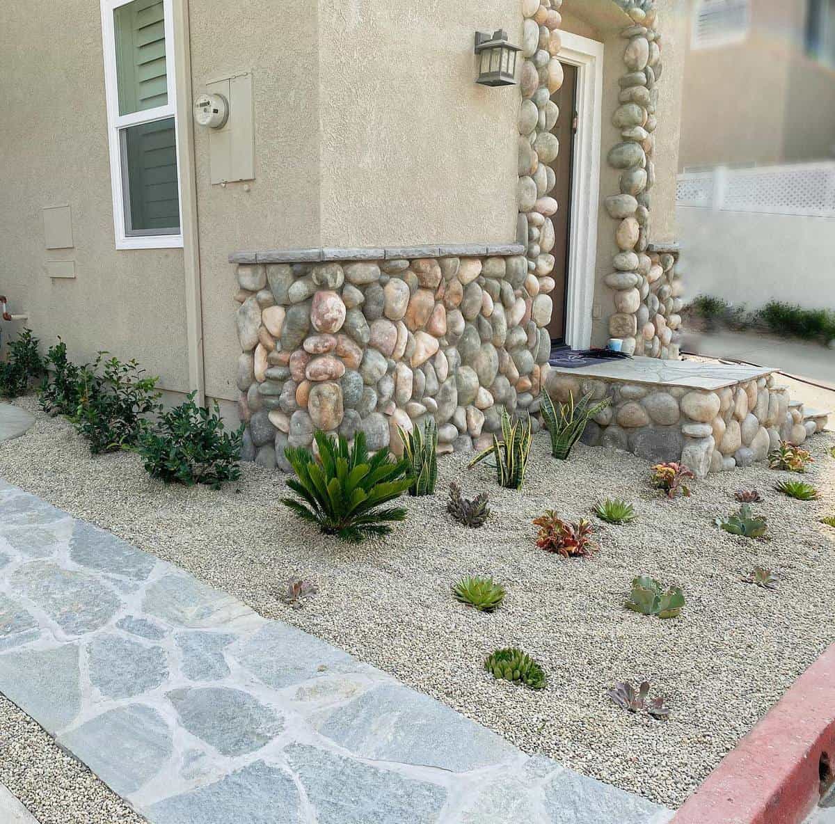 cactus garden grass-free lawn pebbles stone accents 