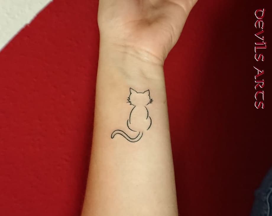 Cat Outline Wrist Tattoo tattooemmels