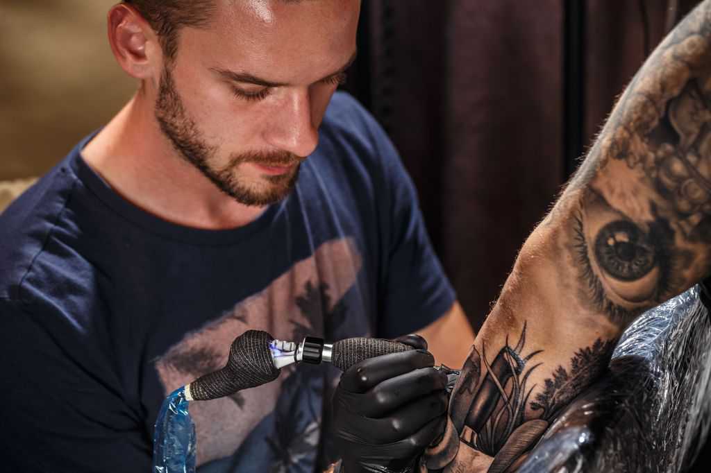 Close Up Tattoo Artist At Work