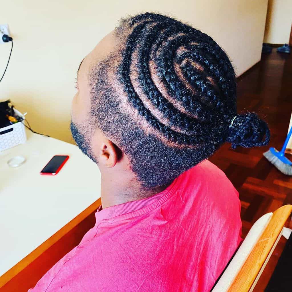 Cornrows Haircut With A Small Knot On The Top