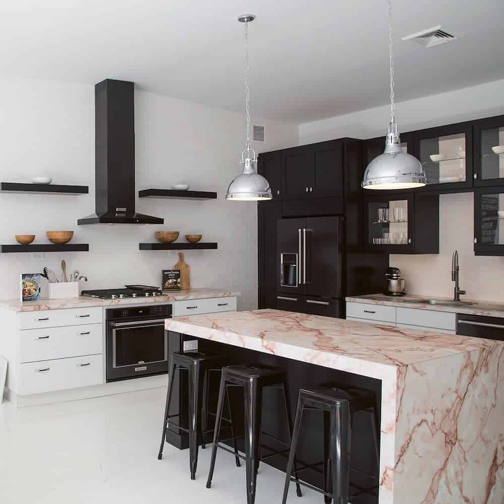 black and white cabinet modern kitchen marble island countertop three black stools 
