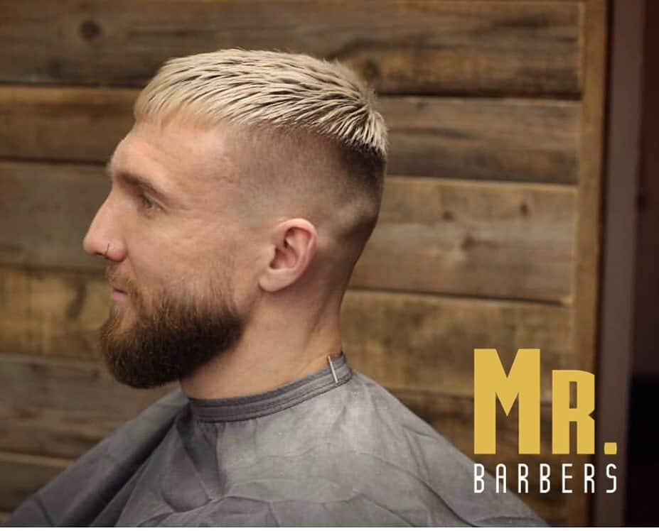 California crew cut hairstyle featuring long highlighted thick hair on top and fade back and sides