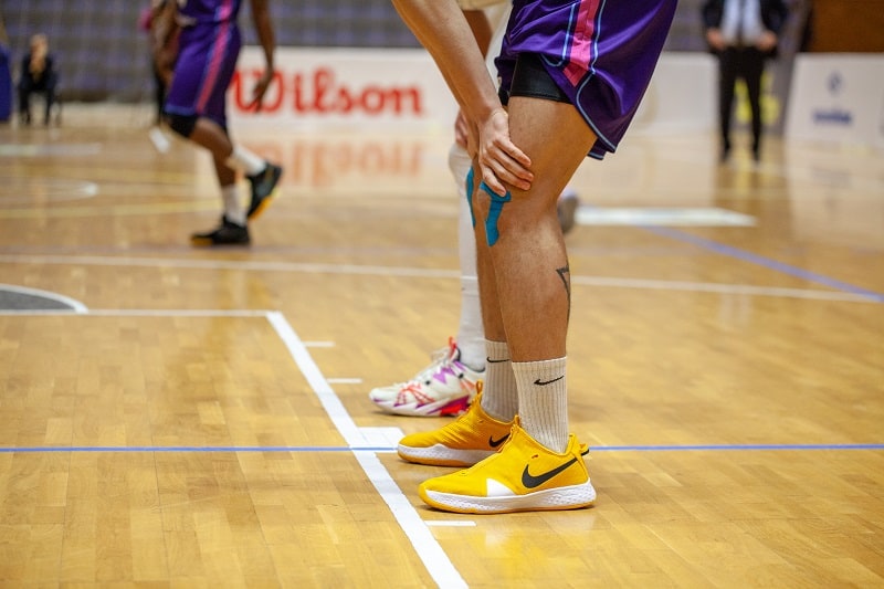 Nike,Yellow,Basketball,Shoes,On,Parquet,Floor,During,Basketball,Match