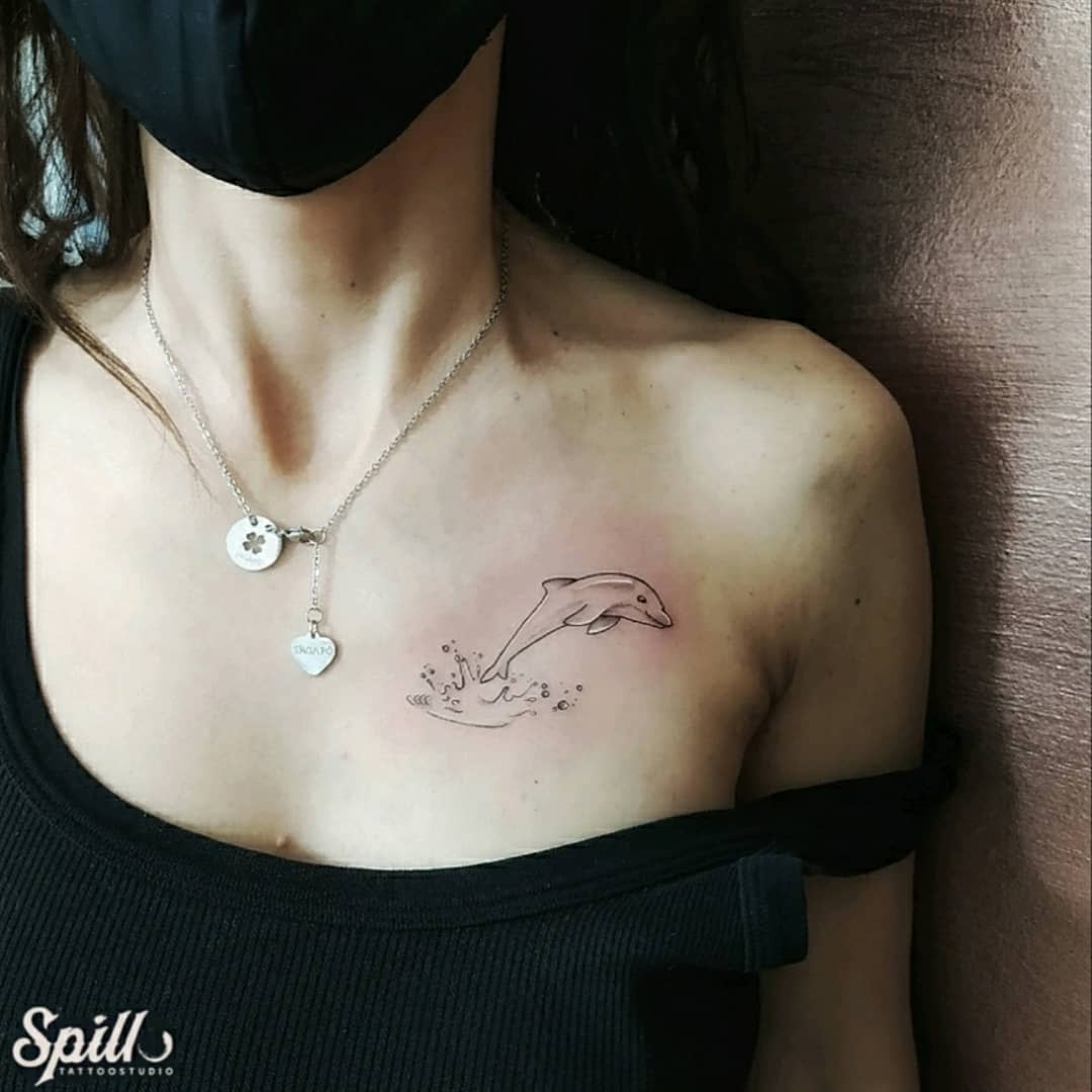 Dolphin Outline Tattoo -spillotattoostudio