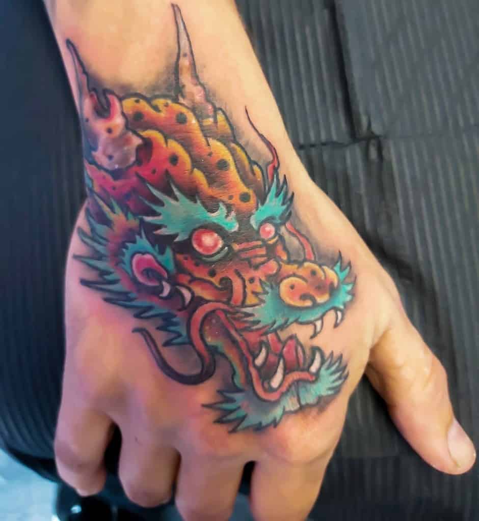 Dragon Head Hand Tattoo nicky_karma_