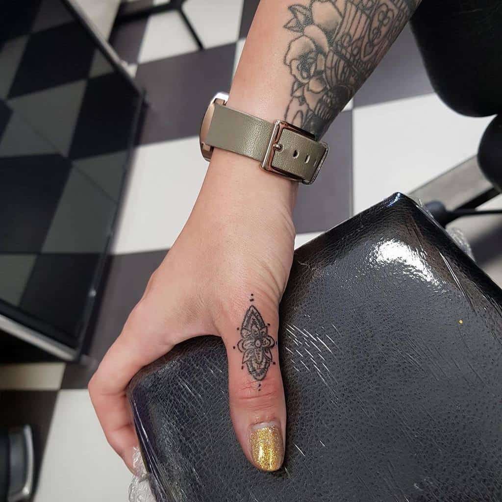 Finger Tattoo Women livingartcollective