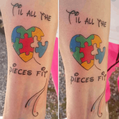 Full color forearm tattoo of Autism Awareness Puzzle heart with an inspirational quote.