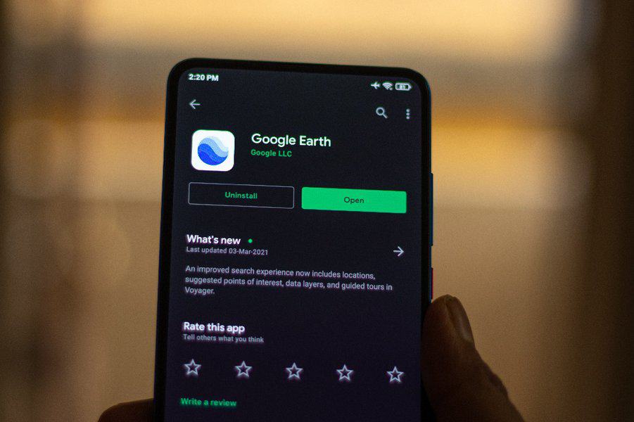 Google Earth logo on phone screen