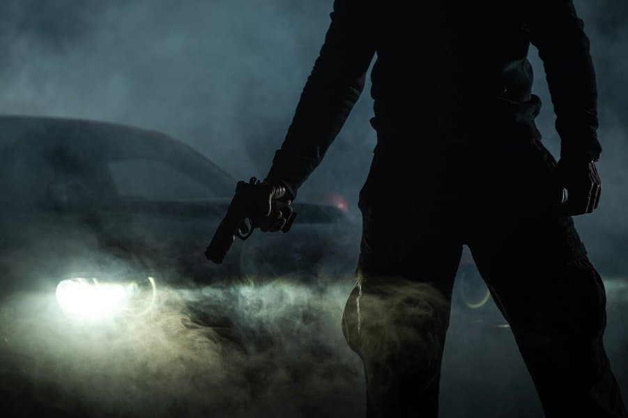 Handgun in Front of His Car During Night Hours