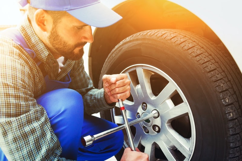 Handyman-Changing-a-Car-Tire