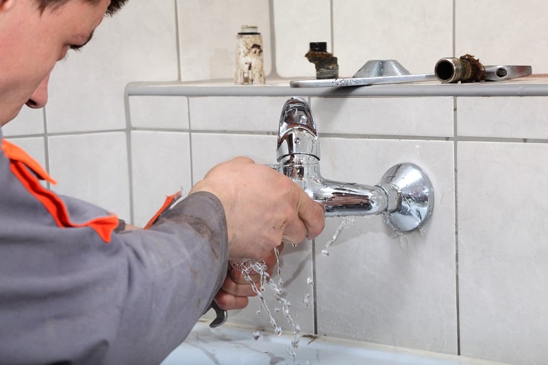 Handyman-Fixing-a-Leaking-Faucet