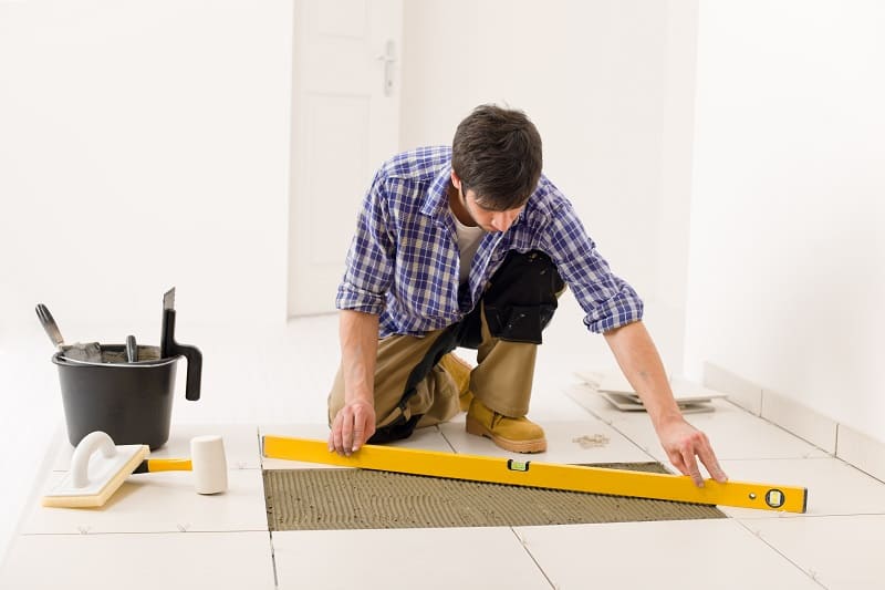 Handyman-Fixing-a-Loose-Tile