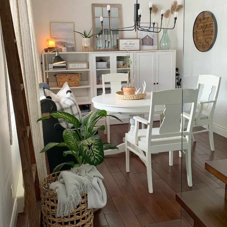 small white wood table and chairs hardwood floor black chandelier