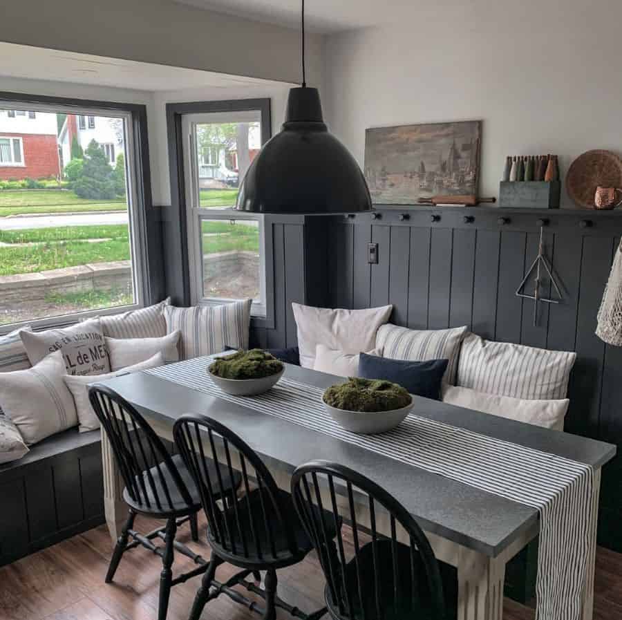 hanging pendant light gray table black chairs bench seating 