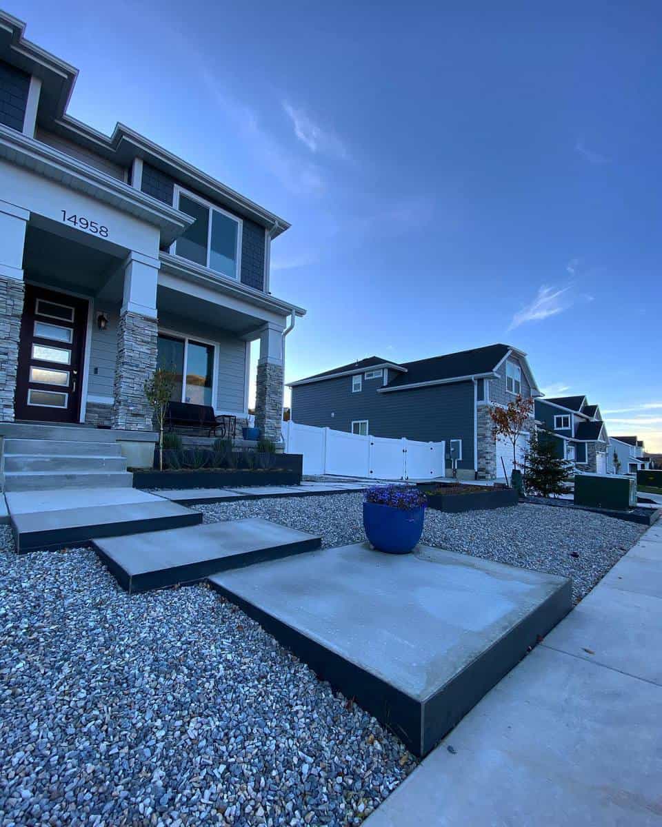 large front yard cement steps gravel garden 