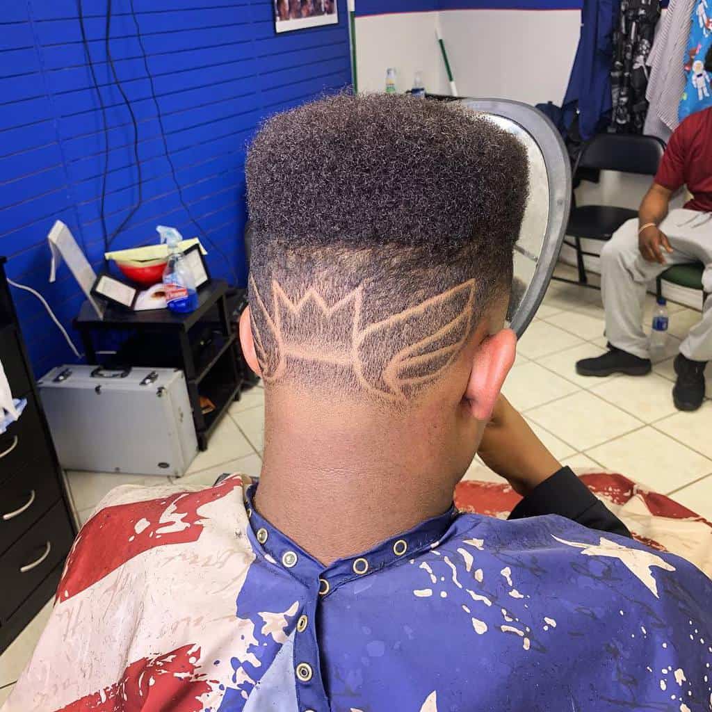 Hi Top Hairstyle With Extended Hair With Flat Top And Designs On The Faded Sides