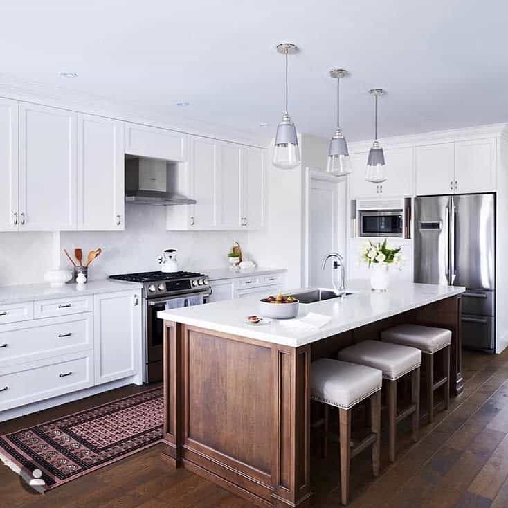 elegant white cabinet kitchen wood island three stools hardwood flooring 