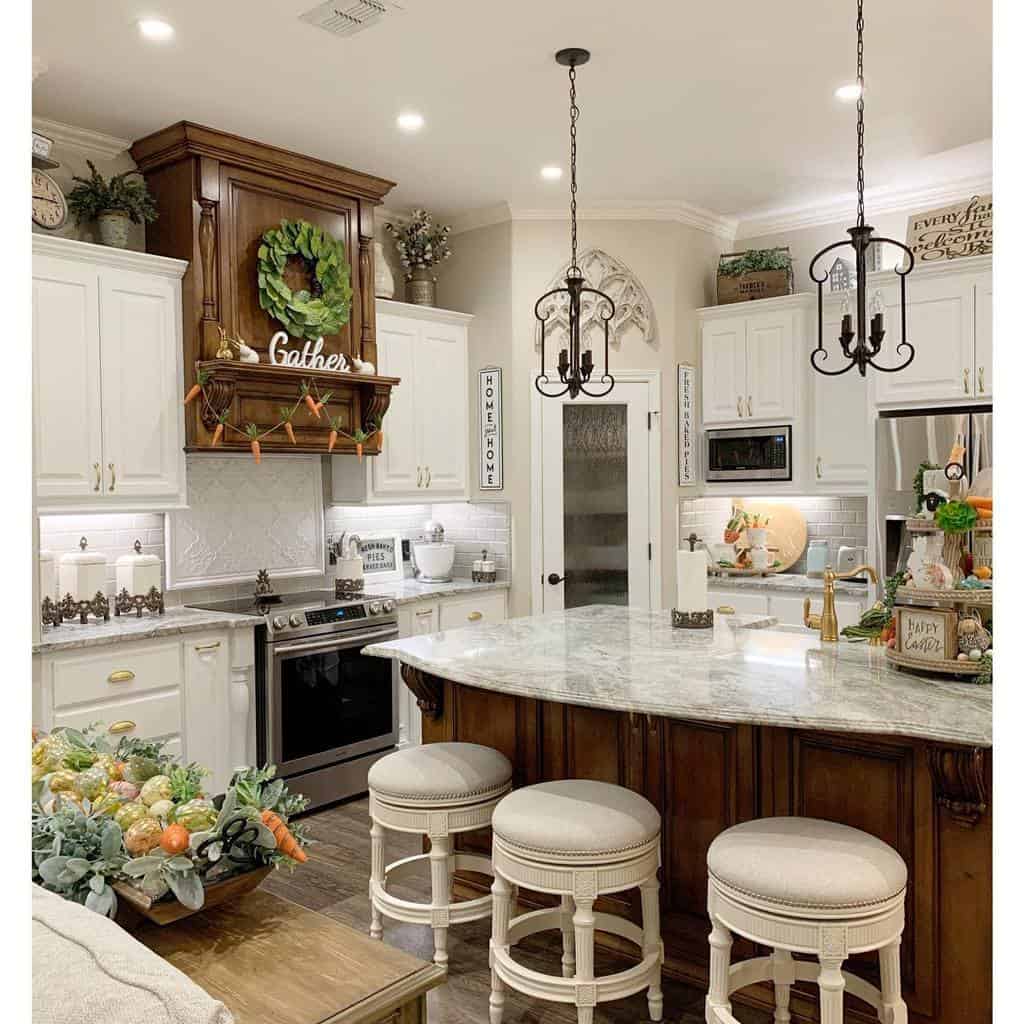rustic kitchen white cabinets three white stools granite countertops candle chandeliers