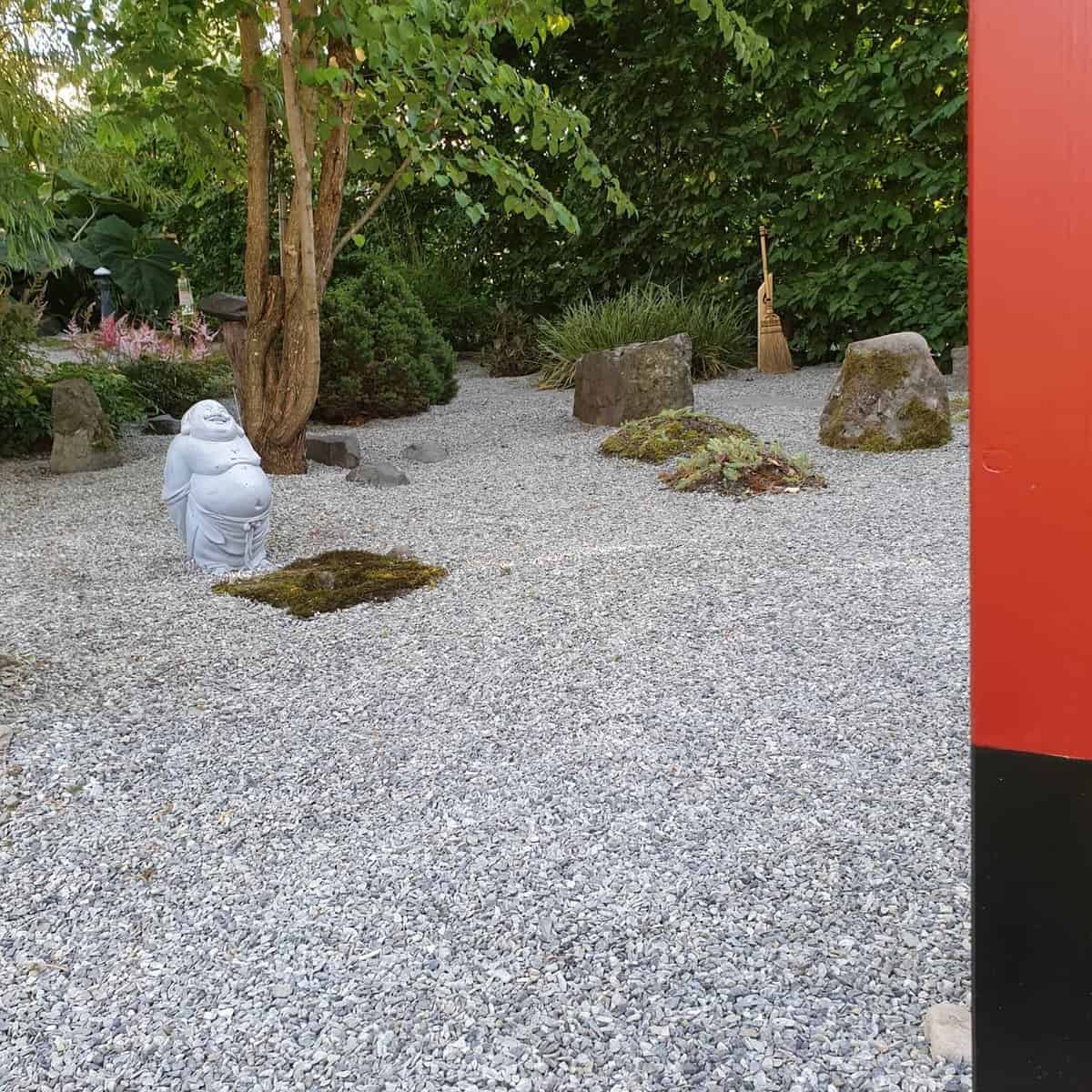 japanese garden white gravel buddha statue 
