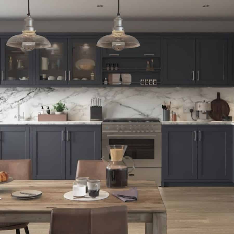 large kitchen gray cabinets marble splashback wood table pendant ceiling lights