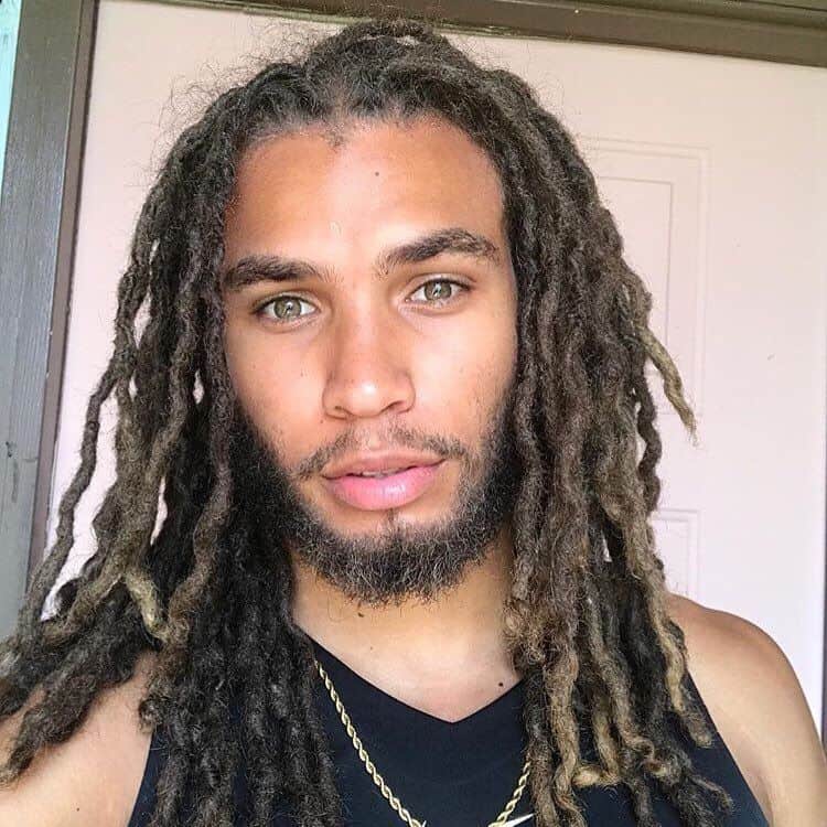 A skater hairstyle with long and clean dreadlocks