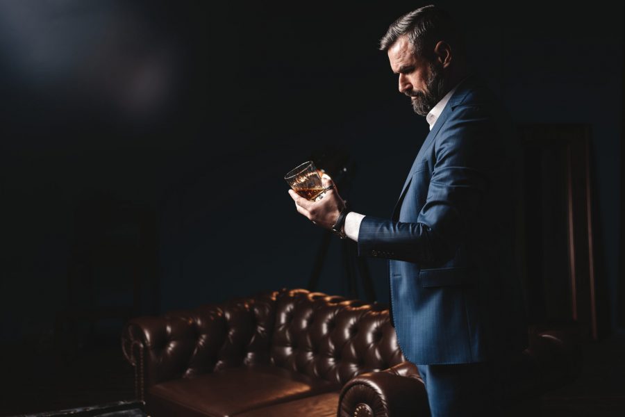 Man Holding Glass of Whiskey
