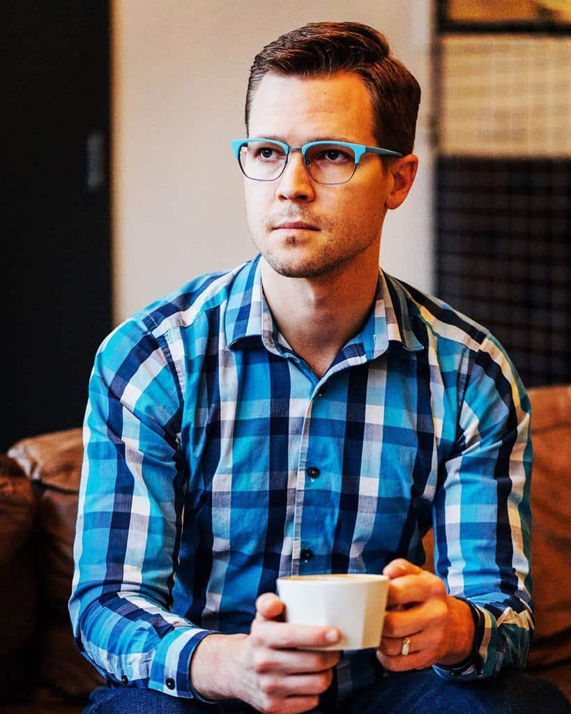 Man In Chequered Shirt Wearing Glasses