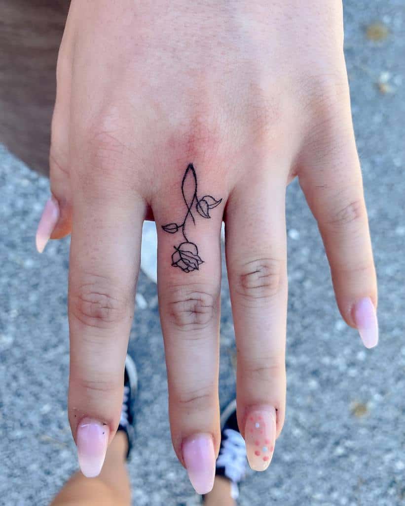 Minimalist Flower Finger Tattoo florenceetlamachine