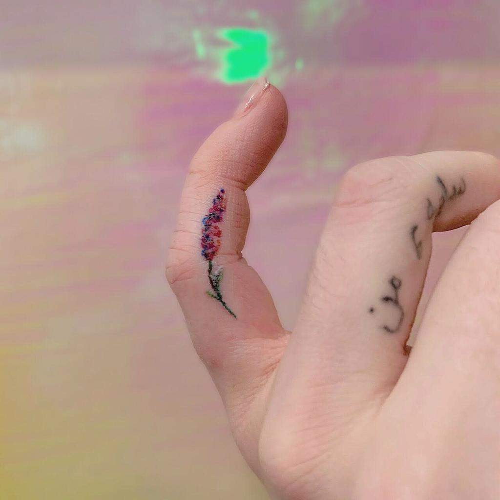 Minimalist Flower Finger Tattoo therealmatthowe