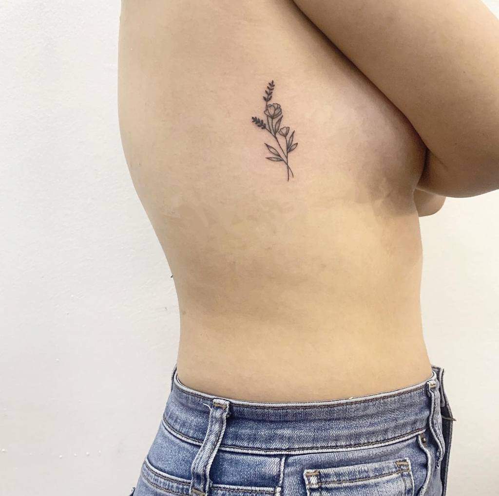 Minimalist Flower Rib Tattoo motus.ink