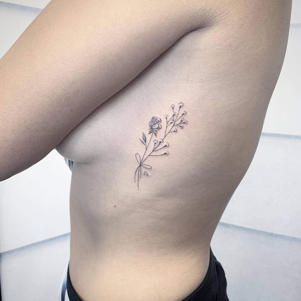 Minimalist Flower Rib Tattoo tony_dang_tattoos