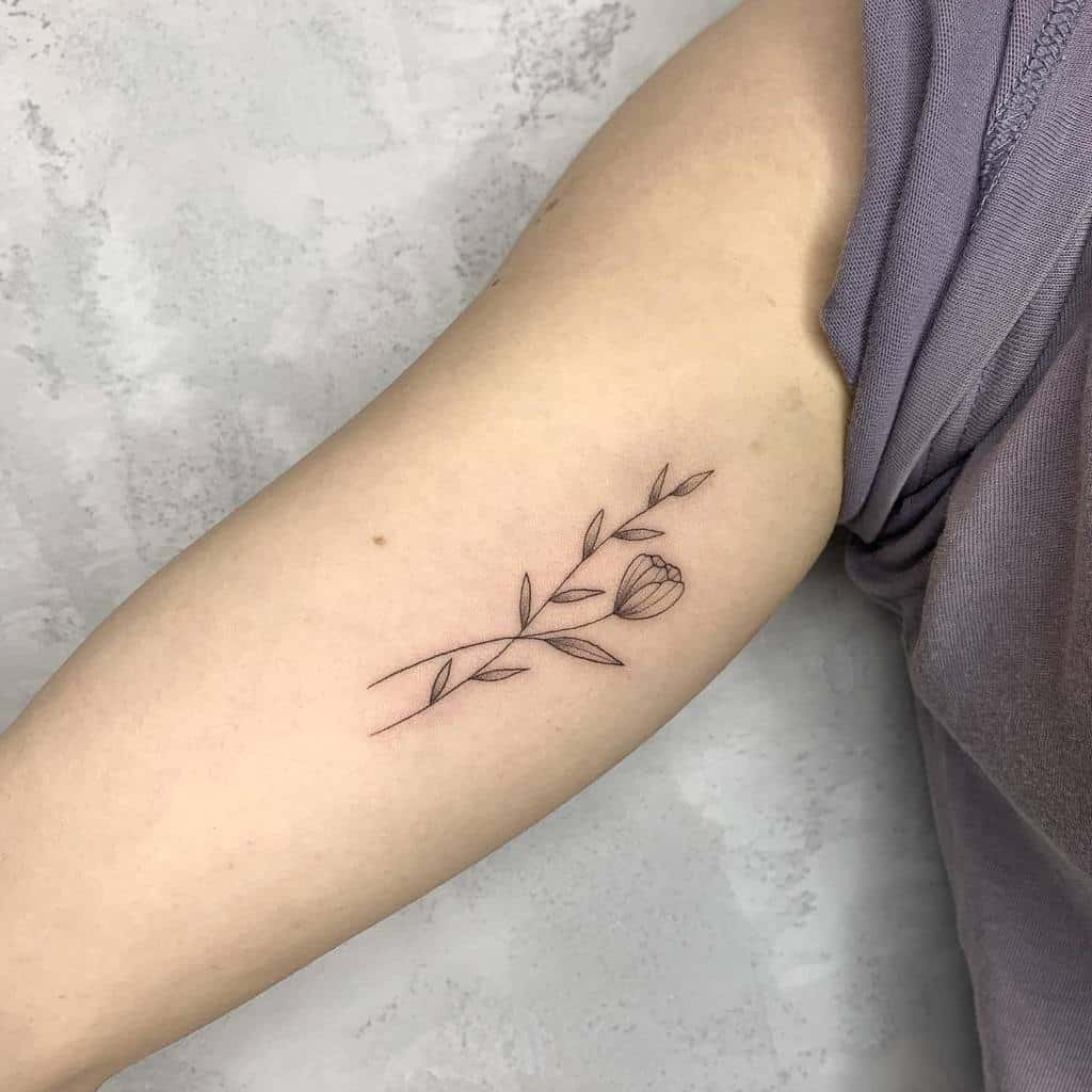 Minimalist Flower Upperarm Tattoo five_knives_tattoo