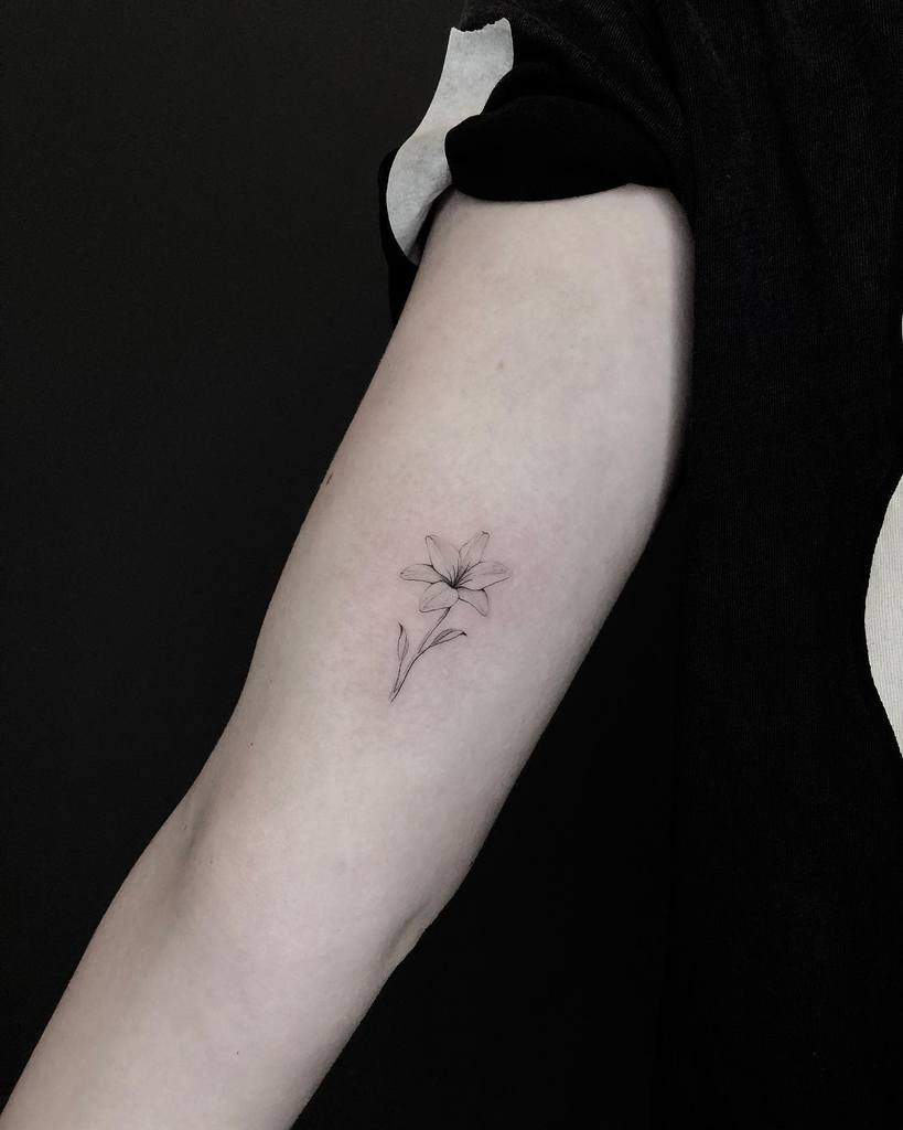 Minimalist Flower Upperarm Tattoo lightgrays_tattoo