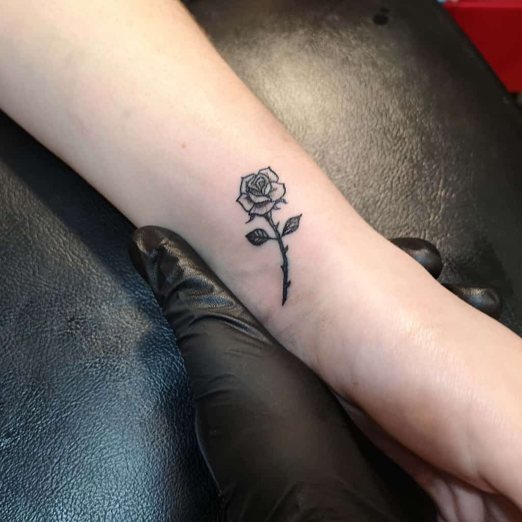 Minimalist Flower Wrist Tattoo carrie_tatts