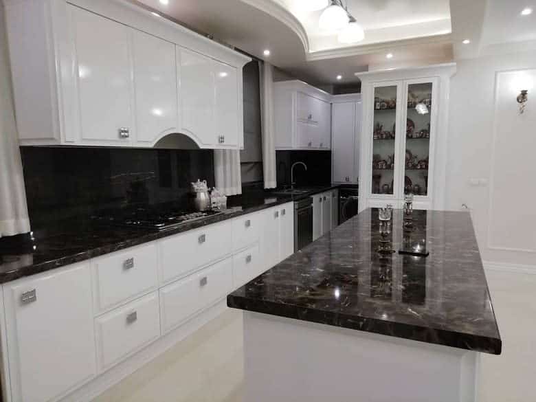 modern white kitchen glass door cabinet black granite island countertop 