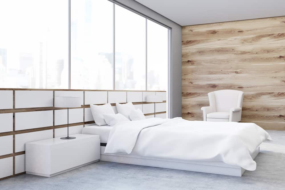 minimalist white bedroom wood feature wall concrete floors