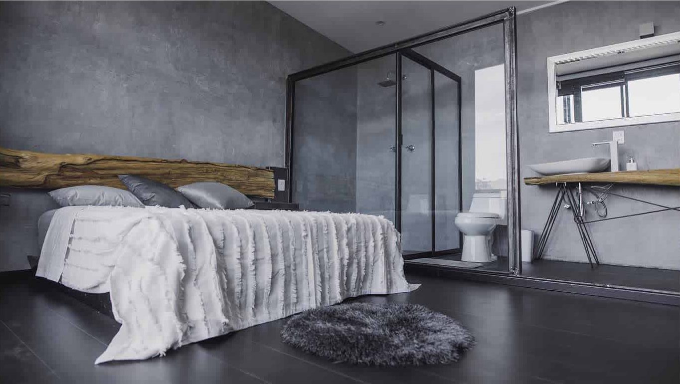 concrete wall modern bedroom with glass window ensuite