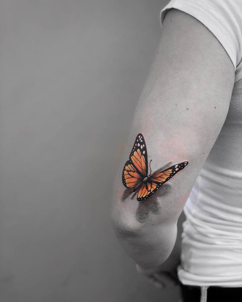 Monarch Butterfly Upperarm Tattoo man_made_tattoo