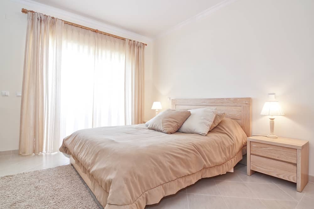 minimalist spare neutral color bedroom 