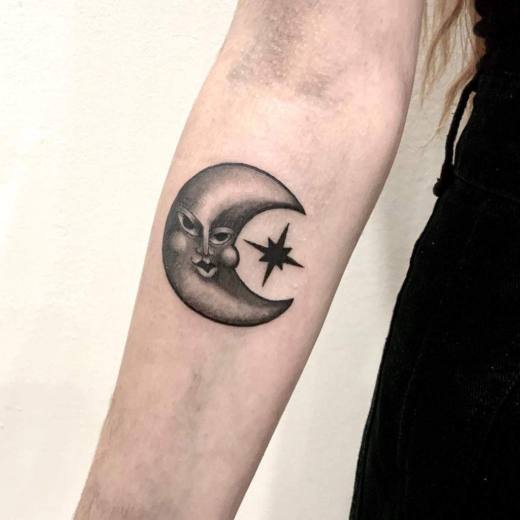 Small moon and star tattoo on the hand