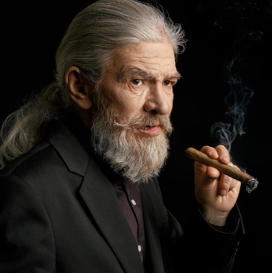 Old Man With Long Silver Hair And Cigar