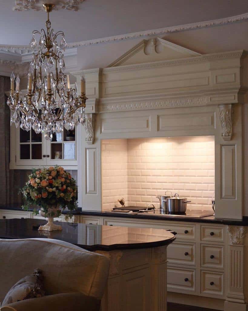 elaborate kitchen stone facade white tile backsplash chandelier