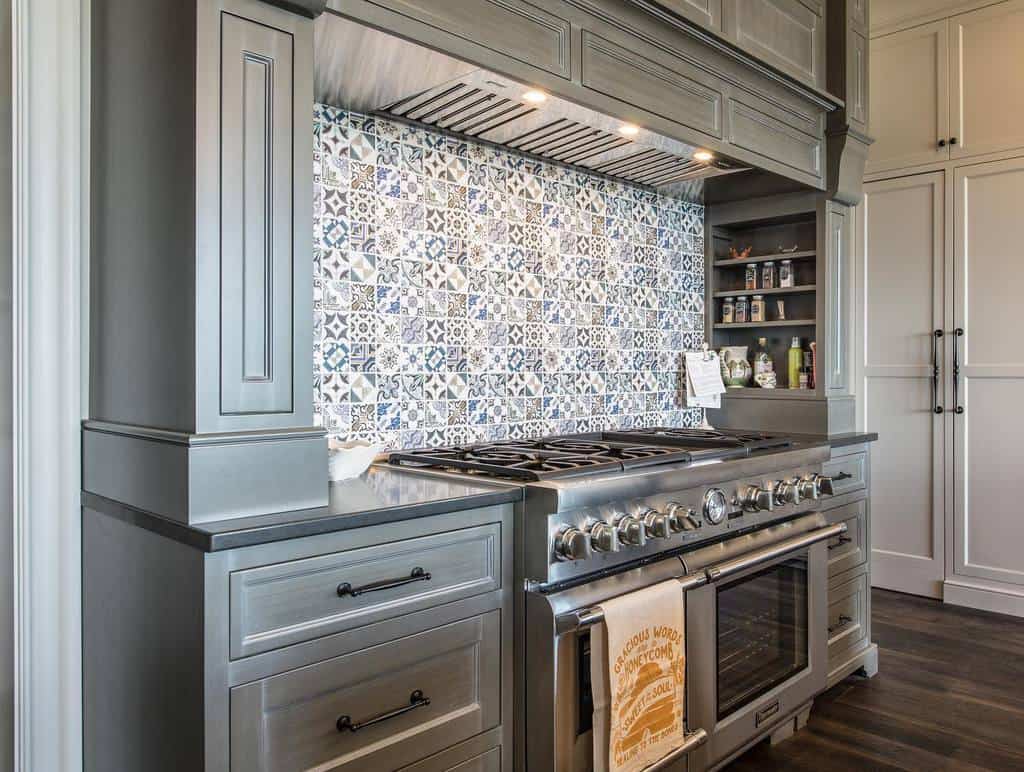 ornate gray kitchen setup pattern tile backsplash white cabinets 