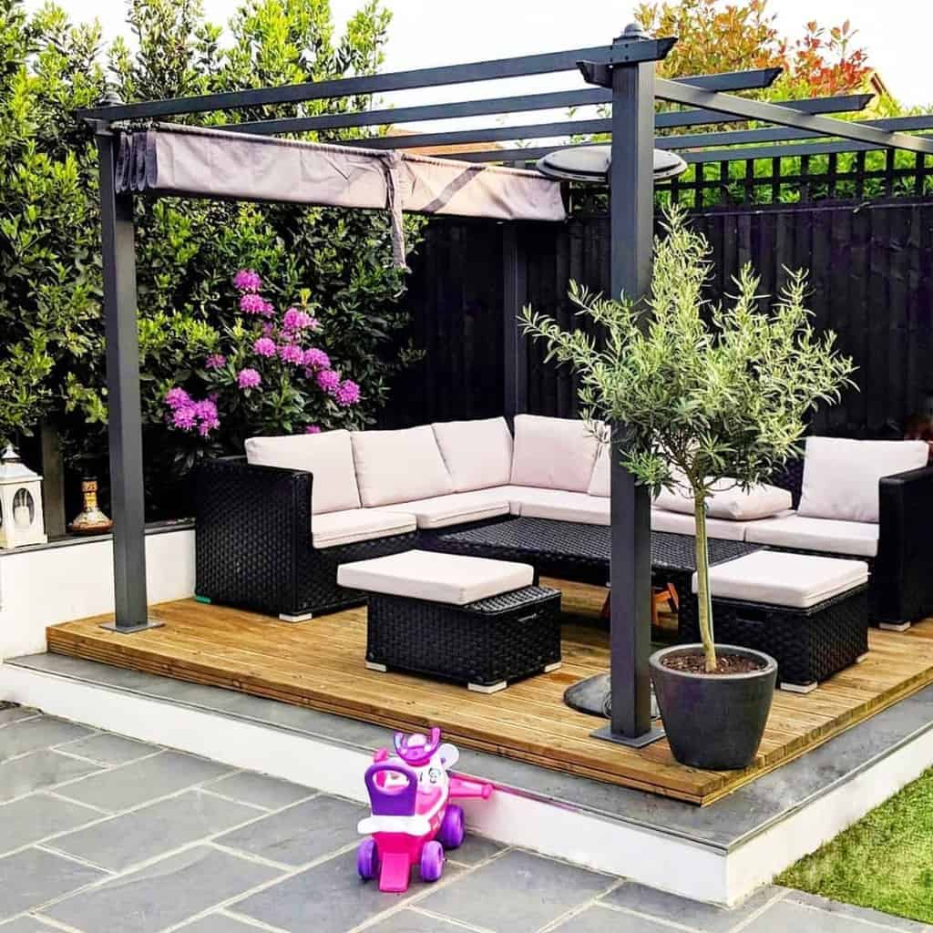 backyard wood deck black gazebo black wicker furniture 