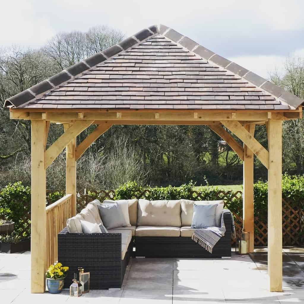 wood pergola with tile roof paver patio wicker l-shape sofa