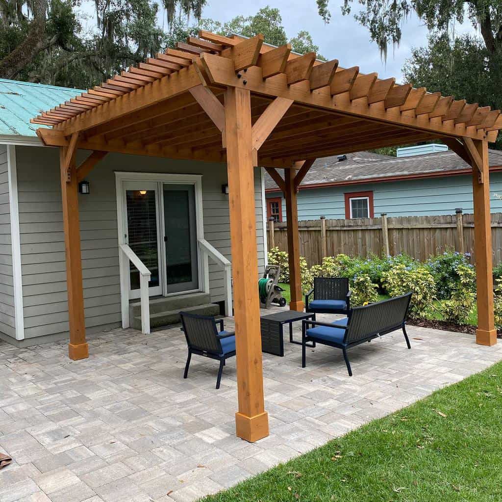 gray paver patio wood gazebo black wicker table and chairs 