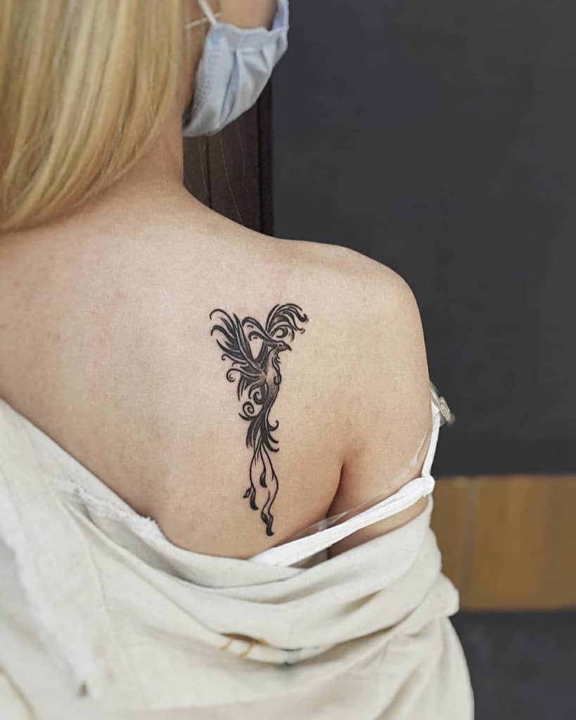 phoenix rising tattoo woman