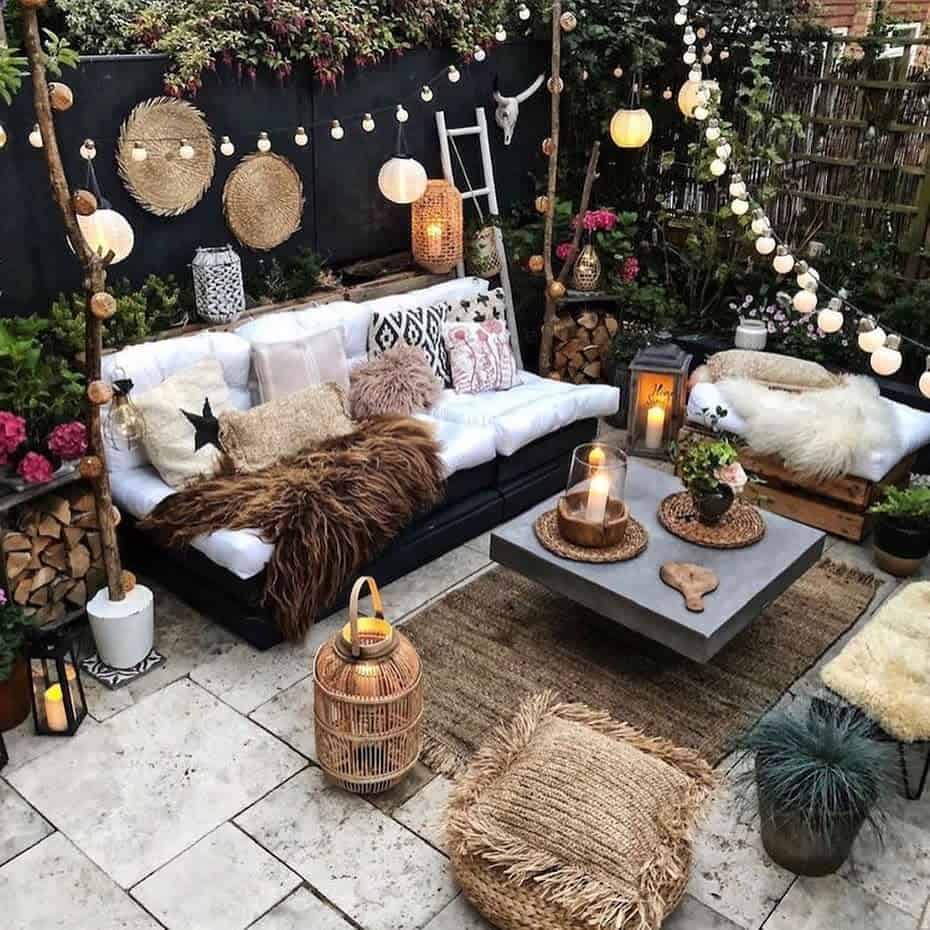 paver patio rustic feel wicker furnishings hanging lights