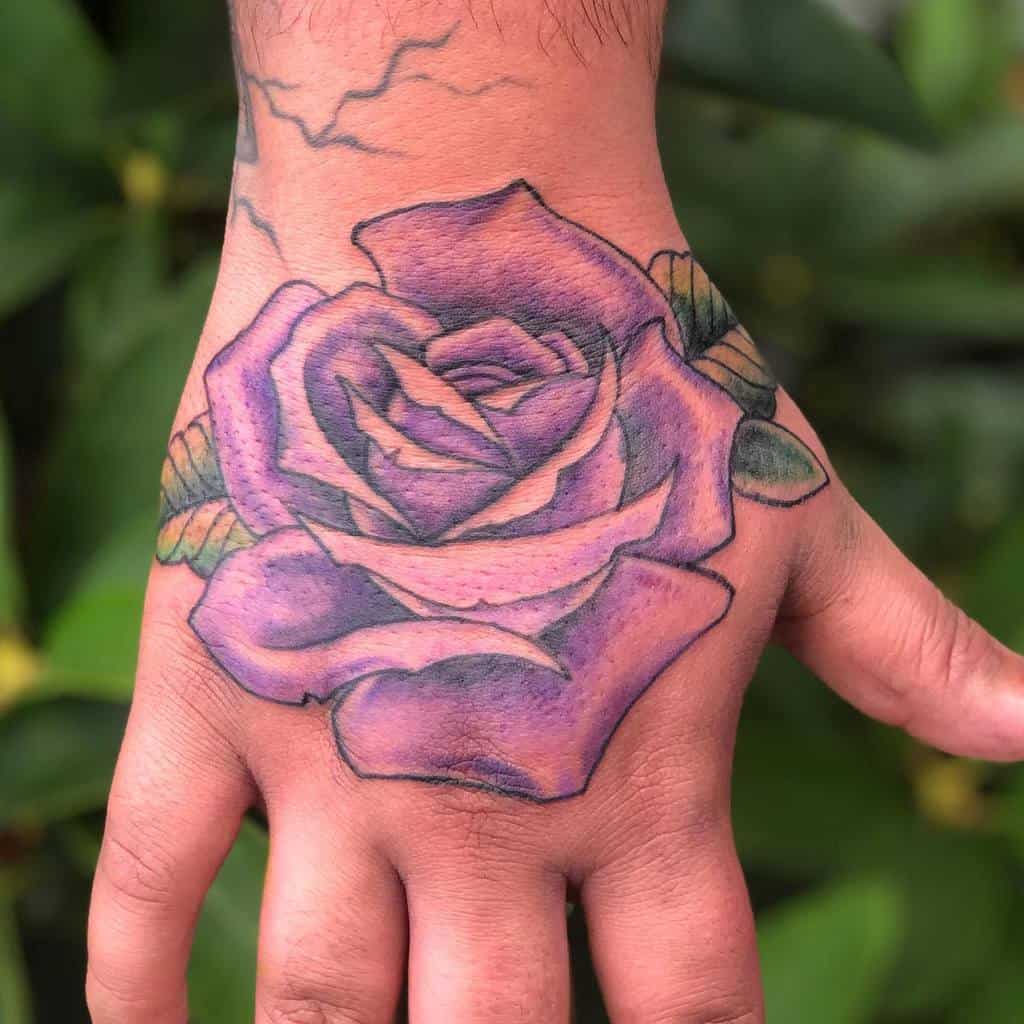 Purple Flower Hand Tattoo connorrudytattoos