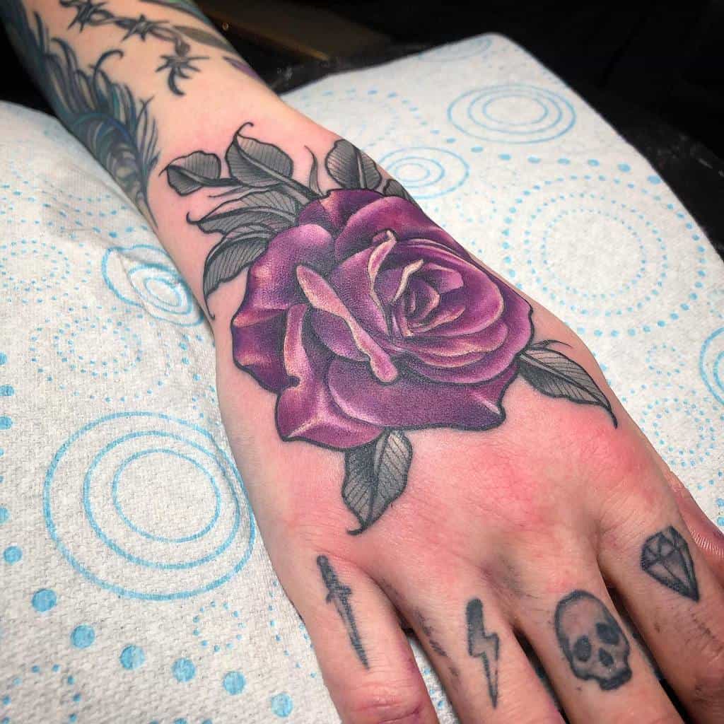 Purple Flower Hand Tattoo infiniteink_coventry